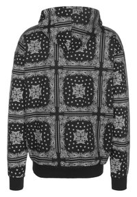 Felpa nera con cappuccio e motivi paisley bianchi e disegni geometrici, dotata di cappuccio con cordino e polsini e fondo a costine.
