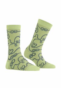 Grüne Socken mit einem verspielten, dunkelgrauen, gedrehten Linienmuster mit Herzen, gerippten Bündchen und verstärkten Zehen. Material aus Baumwollmischung.