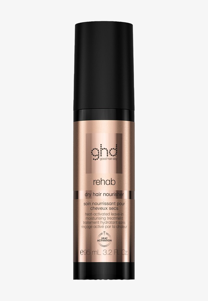 Flacon de soin nourrissant pour cheveux secs ghd Rehab avec bouchon noir, traitement hydratant sans rinçage activé par la chaleur, emballage en rose doré, 95 ml.