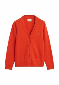 Red cardigan featuring a V-neck, button front, ribbed cuffs, and hem. Subtle logo detail on the chest. Knitted texture.