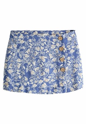 Mini-jupe bleue à motif floral beige et blanc, avec quatre boutons en bois sur un côté à l'avant.