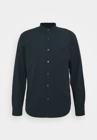 Ciemnozielona, długosleeve koszula z stójką, z zapięciem na guziki z przodu i zaokrąglonym dołem. Wykonana z gładkiego materiału o subtelnej teksturze.