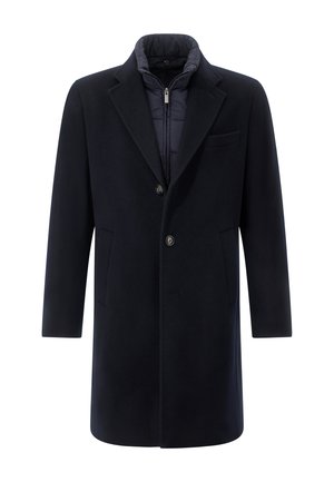 Námořnický modrý vlněný kabát s přiléhavým vnitřním podšíváním, klopovými límci, dvěma předními kapsami a zapínáním na jeden knoflík.