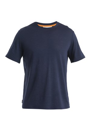 Navy blue crew neck t-shirt made of soft, textured fabric. Features short sleeves and an orange accent on the inner neckline. Classic fit.