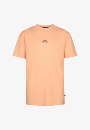 Pfirsichfarbenes Baumwoll-T-Shirt mit Rundhalsausschnitt und kurzen Ärmeln. Mit einem kleinen schwarzen Grafikdruck auf der Vorderseite. Weiche Textur.
