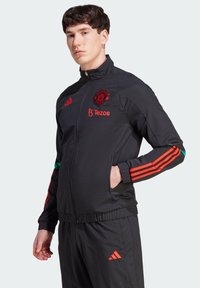 adidas Performance - MANCHESTER UNITED TIRO 23 PRESENTATION TRACK - Joukkuetuote - schwarz Pienoiskuva 1