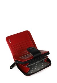 Red leather wallet with a zip closure, multiple card slots, black accents, and a polka dot lining. Secure snap closure for easy access.