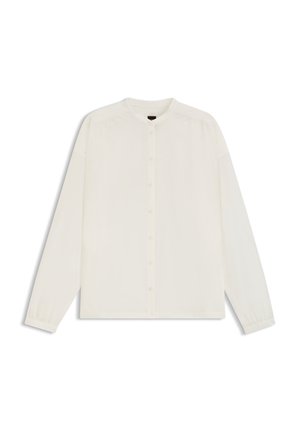 Wit shirt met lange mouwen gemaakt van lichtgewicht stof. Voorzien van een ronde halslijn, knopen voor, en plooidetail bij de schouders.