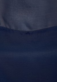 Navy blue fabric with a smooth, matte texture, featuring a subtle sheen. Seamless design with no notable patterns or accents.