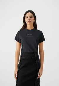 Calvin Klein - MULTI LOGO REGULAR - Basic póló - black Miniatűr kép 1