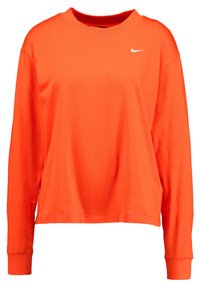 Långärmad orange bomullströja med rundad hals, med en liten vit Nike-logga på vänster sida av bröstet.