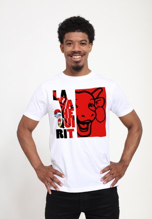 White cotton T-shirt featuring a bold graphic design with black and red colors, text, and an illustration of a smiling face.