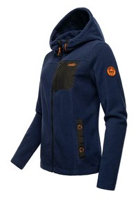 Navy blue fleece jacket with a black chest pocket, orange accents, hood, and two-button closure on the side. Soft texture, fitted design.