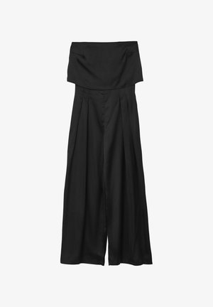 Pantalons larges noirs avec une taille haute et structurée, présentant des plis sur le devant et un tissu lisse et léger.