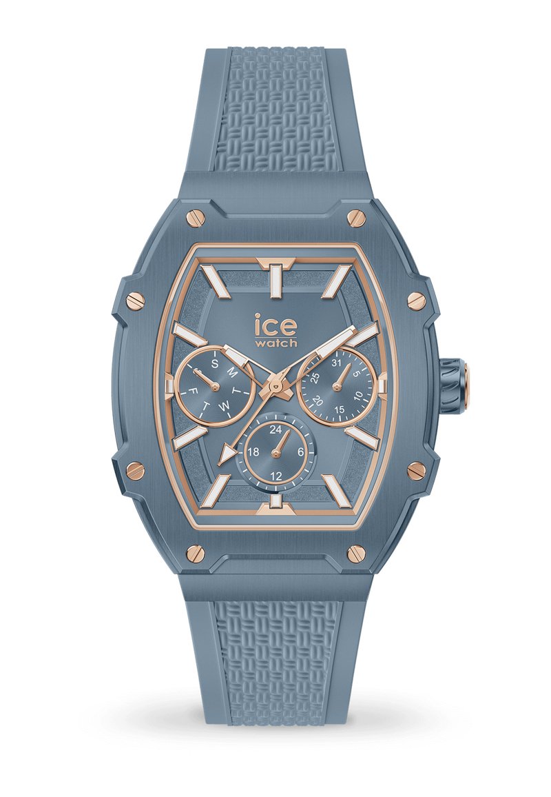 Blaue Uhr mit einem strukturierten Silikonarmband, achteckigem Gehäuse, goldenen Akzenten, mehreren Ziffernblättern und einem gemusterten Ziffernblatt zur Anzeige von Datum und Uhrzeit.