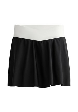 Black skort with a white, crossed waistband. Features a flared design, lightweight fabric, and smooth texture. Suitable for active wear.
