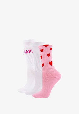 Three pairs of socks: one white with "HAPPY" in pink letters, one plain white, and one light pink with red heart patterns, all mid-calf length.
