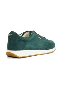 Green suede sneaker with white sole and gum rubber outsole. Gold logo accent on the heel. Rounded shape with flat laces and eyelets.