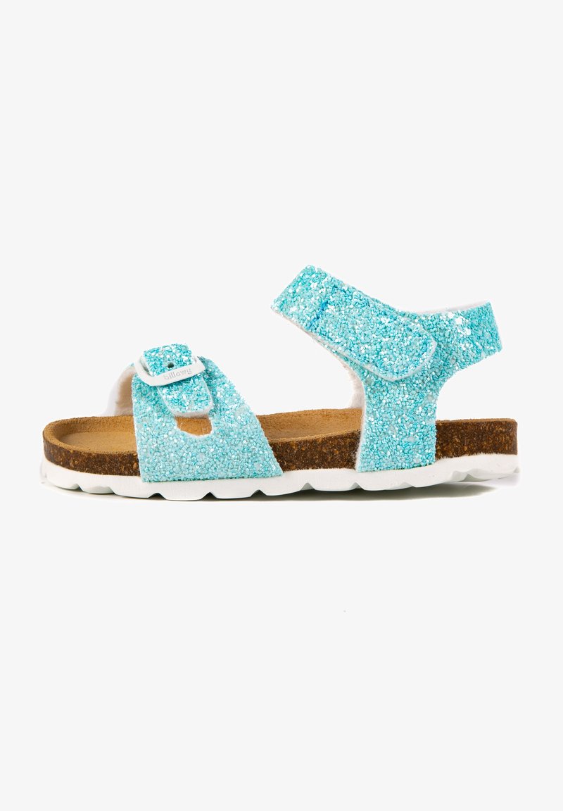 Sandale turquoise pailletée avec deux straps réglables, semelle en liège et semelle en caoutchouc blanc. Présente un dessus texturé et scintillant.