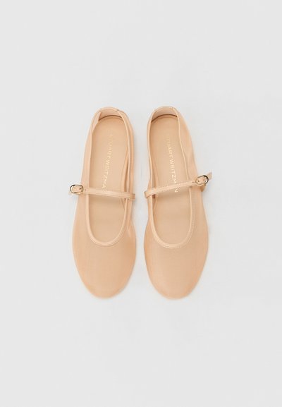 Nude ballet flats made of smooth material, featuring a strap with a metallic buckle, rounded toe, and minimalistic design.