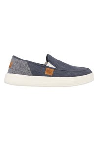 Blauwe instappers van een denim-achtige stof, met een neutrale rubberen zool en een bruine logotag. Beschikt over elastische zijkanten voor gemakkelijk aan- en uittrekken.