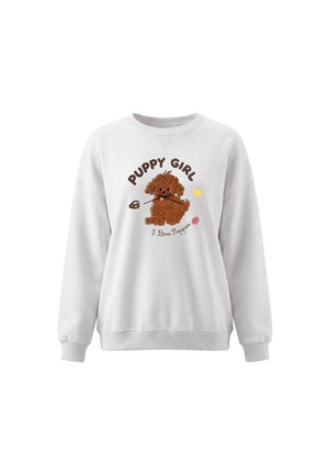 Hvid sweatshirt med en brun tekstureret hvalp, der holder en pind, tekst med "Puppy Girl" og "I Love Puppies" med små farverige ikoner omkring.