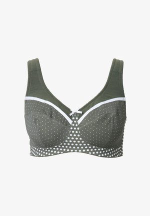 Bra verde oliva con pois bianchi e bordi a contrasto. Presenta spalline larghe, un dettaglio a mock button al centro e una texture di tessuto liscia.