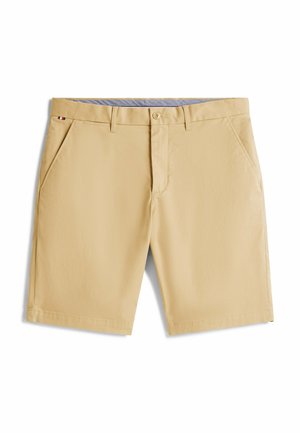 Beige Shorts aus leichtem Material, mit zwei Seitentaschen, einem Knopfverschluss und einem blauen, gemusterten Bund.