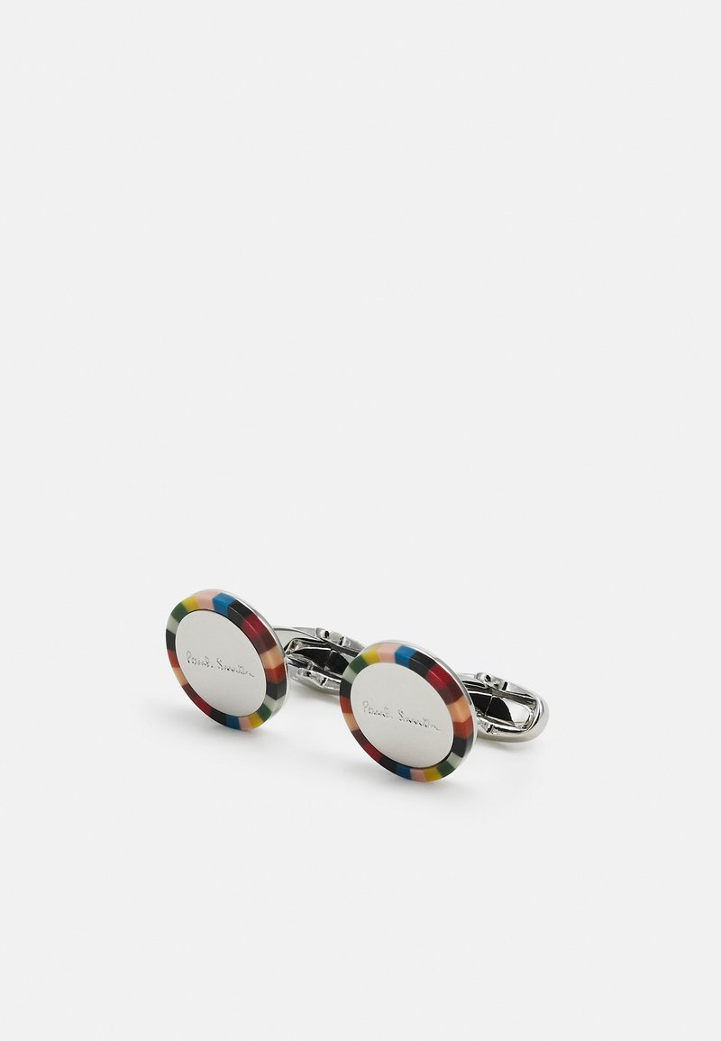 Fargerike sirkulære mansjettknapper med mønstrete kant, metallisk senter gravert med "Paul Smith," og sølvfarget maskinvare.