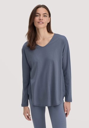 Langärmliges, V-Ausschnitt-Oberteil aus weichem, mittelblauem Stoff mit lockerer Passform und abgerundetem Saum, kombiniert mit passenden Leggings.