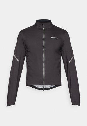 Svart lättvikts cykeljacka med långa ärmar, hög krage, dragkedja fram och reflekterande detaljer på ärmarna. Slät, texturerad tyg.