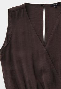 Blouse sans manches marron foncé style cache-cœur avec col en V et ouverture en forme de goutte dans le dos, taille 36, marque Opus.