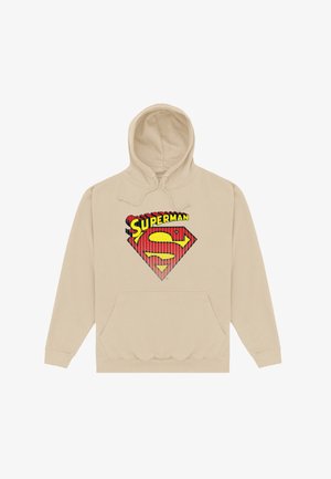 Sudadera con capucha beige con bolsillo frontal, que presenta un gráfico del logo de Superman en rojo y amarillo en el pecho. El material parece suave, con una capucha ajustable con cordón.