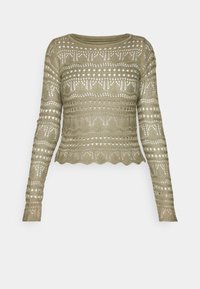 Strickpullover mit langen Ärmeln in hellolivgrün, mit offener Stricktechnik, welligem Saum und geometrischen Mustern durchgehend.