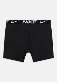 Mustad musta värvi Nike boxerid valge logo vöökohtaga, täpselt nahka järgivad ja sujuva lõikega. Mugavuse nimel on need varustatud ka kontuuritud taskuga.