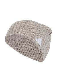 Beanie made of knitted fabric in light beige. Features ribbed texture and a small white logo tag on the side. Classic, rounded cap shape.