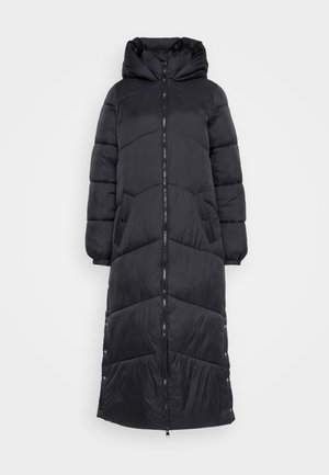 Long black puffer coat with a hood, featuring quilted design, zip front closure, and side pockets. Smooth, matte texture and relaxed fit.
