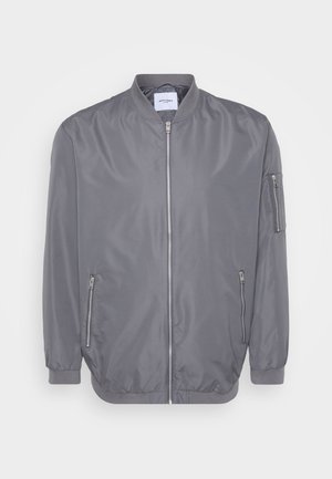 Gray bomber jacket with a zip front, ribbed collar and cuffs, side zip pockets, and a small arm pocket. Smooth, lightweight fabric.
