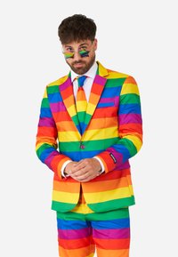 Rainbow-striped suit made of smooth fabric with a tailored fit. Includes a matching tie and sunglasses with star-shaped lenses.
