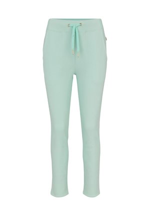 Hellgrüne Jogginghosen aus weichem Stoff, mit einem Tunnelzug in der Taille mit goldenen Akzenten und einem enganliegenden, zulaufenden Bein.