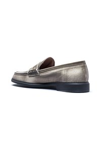 Metallic silver loafers with a smooth leather upper, rubber sole, and stitched detailing on the vamp. Side view emphasizes sleek design.