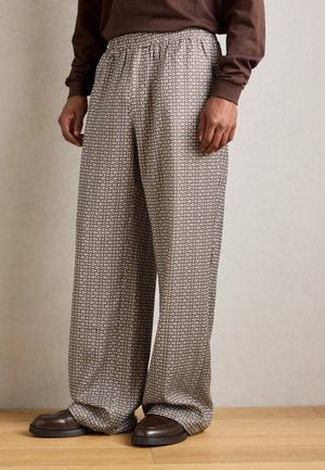 MAKOKO MONOGRAM PRINT TROUSERS - Trousers - brown