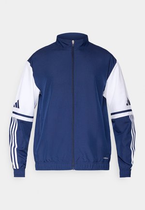 Navy blue zip-up jacket with white sleeves, featuring three stripes on each arm and a high collar. Made from smooth, lightweight fabric.