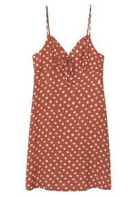Ruskean värinen mekko, jossa on valkoisia pilkkuja, säädettävät spagettiolkaimet, V-aukkoinen kaula-aukko ja edessä solmittava yksityiskohta. Pehmeä kangas, yksinkertainen A-linjainen muoto.