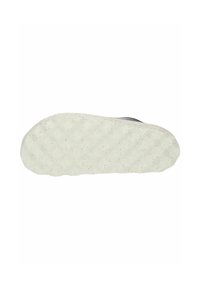 Suola della scarpa di colore bianco crema, superficie testurizzata e un motivo ondulato. Il materiale sembra gommoso con piccole macchie sparse.