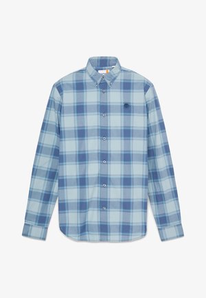 Košilové triko s dlouhým rukávem v světle modré a tmavě modré kostičkované vzoru. Vyrobeno z bavlny, s límečkem na knoflíky a logem na hrudi.