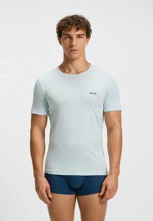 Light blue short-sleeve T-shirt in soft fabric with a crew neckline; features a small "BOSS" logo in dark blue on the chest.