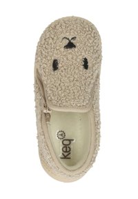 Beige slipper with textured, fluffy exterior. Features a zip closure and a simplistic rabbit face design. Soft inner lining and flexible sole.