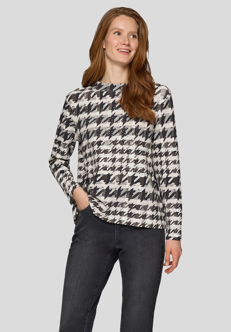 Langärmeliges Oberteil in Schwarz-Weiß mit Hahnentrittmuster, mit rundem Ausschnitt und lockerem Schnitt, gefertigt aus weichem, strukturiertem Stoff.