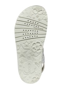 Sole in gomma bianca con un motivo floreale e a stelle, dotata di fori di ventilazione e con la dicitura "FLEXY SYSTEM" e la taglia "27".